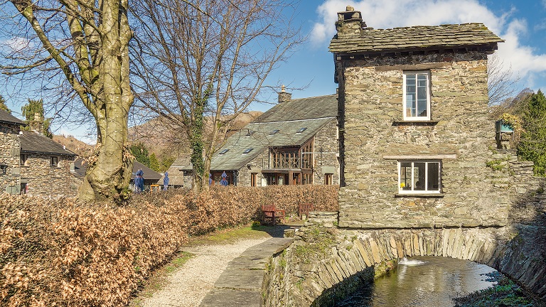 The 17th Century bridge house in Ambleside, one of the many historic buildings that can be found in this characterful Lake District town
